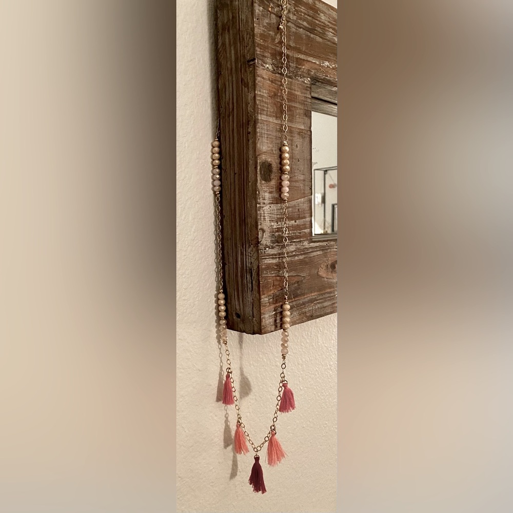 Gold tone, pink tassel necklace